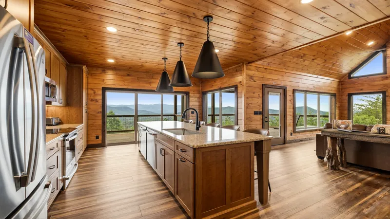 Kitchen with granite island and mountain views
